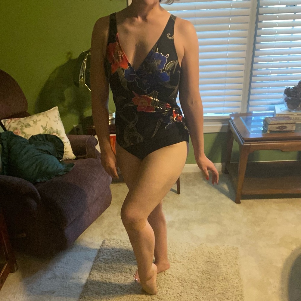 Wrap-style black full swimsuit with flower details